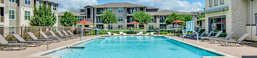 our apartments offer a swimming pool with chaise lounge chairs