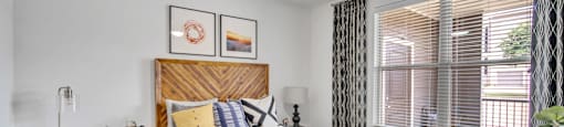 a bedroom with a bed and a ceiling fan