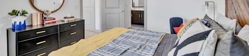 a bedroom with a bed and a ceiling fan