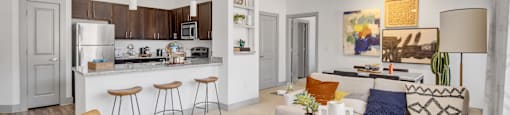 a living room and kitchen with a ceiling fan