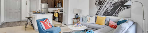 an open living room and kitchen with a couch and a table