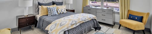 a bedroom with a bed and a ceiling fan