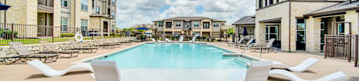 the preserve at ballantyne commons pool with apartment buildings