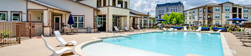 our apartments have a large swimming pool with lounge chairs