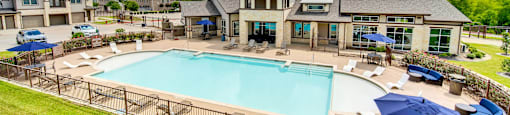 the preserve at ballantyne commons pool and resort style buildings with umbrellas
