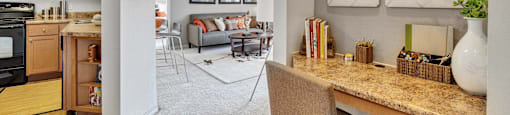 a living room with a kitchen and a dining room
