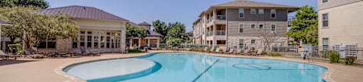 the preserve at ballantyne commons community swimming pool with apartment buildings