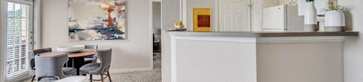 a living room with a kitchen and a dining room