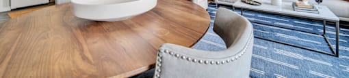 a living room with a dining room table and a kitchen