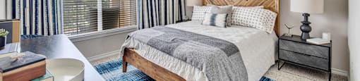 a bedroom with a bed and a ceiling fan