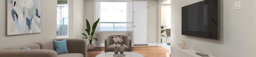 A living room with a brown couch, a coffee table, and a flat screen TV mounted on the wall.