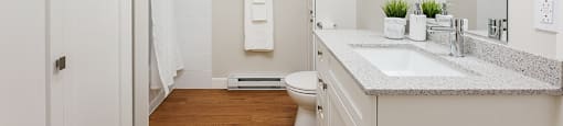 Bourg Du Village bathroom with tiled shower and tub and vanity with granite countertop Sainte Therese, QC