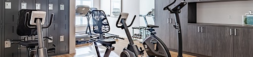 Fully equipped fitness centre and yoga studio at La Voile Broisbriand apartments in Broisbriand, Quebec