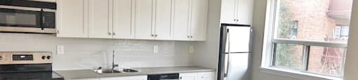 Berry Road in Etobicoke, ON kitchen with modern cabinetry and countertops