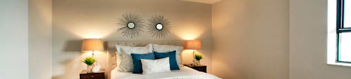190 Cityview in Brampton, ON Spacious bedroom with two blue pillows and a fluffy comforter