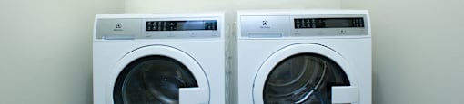 190 Cityview in Brampton, ON In suite washer and dryer with shelves above both