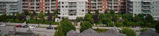 A view of a residential area with houses and apartment buildings.