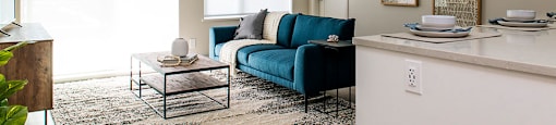 Inlet Glen Apartments in Port Moody, BC living room with access to private balcony or patio