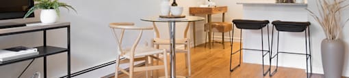 Glades on 55 dining area featuring brightly lit kitchen with breakfast bar in Langley, BC