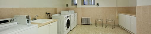 300 St. Clair Ave West in Toronto, ON Amenity room with washer, dryer, and sink
