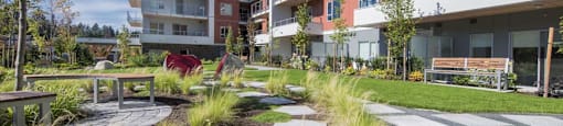 Inlet Glen Apartments property exterior featuring walkway in Port Moody, BC
