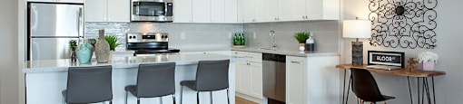 Royal Rose in Etobicoke, ON large kitchen island and overhead lighting