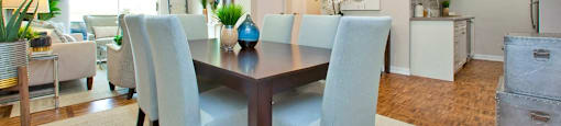 Acton Apartments dining area that comfortably fits large table with eight chairs in Acton, ON