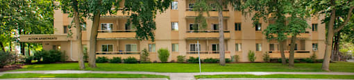 Acton Apartments exterior image of building surrounded by trees in Acton, ON
