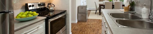 Acton Apartments kitchen with stainless steel appliances and over