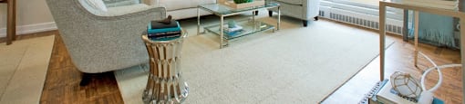 Acton Apartments living room with hardwood flooring and access to balcony in Acton, ON