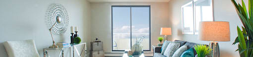 Albany Place spacious living room with access to balcony in Fort Erie, ON
