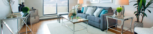 Albany Place large living room with hard surface flooring and access to balcony in Fort Erie, ON