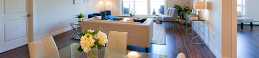 Amesbury Gate Dining room with clear table and yellow flowers in a vase in Bedford, NS