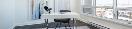 Home office with large windows at Axial Towers apartment in Laval, Quebec