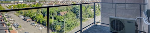Stunning view of surrounding residential area and green space from balcony at Axial Towers apartment