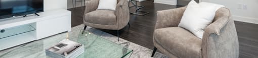 Open concept living room with premium finishes at Axial Towers apartments in Laval, Quebec