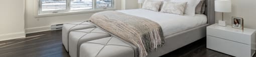 Modern and spacious bedroom at Axial Towers apartment in Laval, Quebec