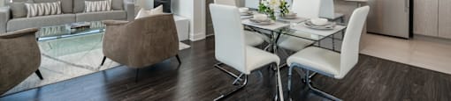 Spacious open concept living room and dining room at Axial Towers apartment in Laval, Quebec