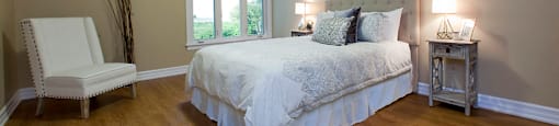 Baker Arms & Wexford Apartments large bedroom with hardwood flooring in Dartmouth, NS