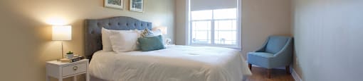Baker Arms & Wexford Apartments roomy bedroom with hardwood flooring in Dartmouth, NS