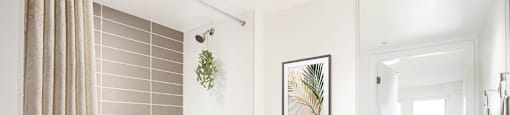 A bathroom with a white tub, toilet, and sink at 388 Kaslo East Village.