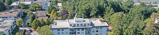 Bayview Gardens Apartments drone image of property with waterfront view in White Rock, BC