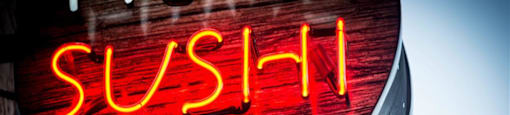 Neon sign that reads sushi