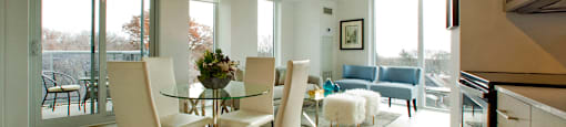 BeachHill Apartments open concept apartment featuring floor to ceiling windows with view of the balcony in Toronto, ON