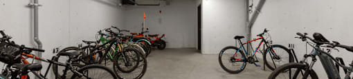 A bike parking area with bikes on both sides of the room at The Ambrosi in Kelowna, BC.