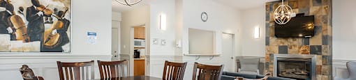 Bourg Du Village social room showing dining area in Sainte Therese, QC