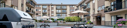 Braemar Gardens apartments courtyard with bbq, seating and planters in Coquitlam, BC