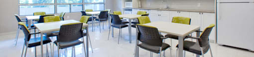 Brighton Court social room with tables and chairs in Windsor, ON