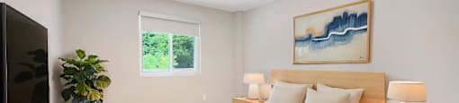 A bedroom with a bed, nightstands, and a painting on the wall.