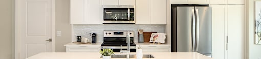 kitchen wit stainless steel appliances at Brookline Apartments in Bedford NS